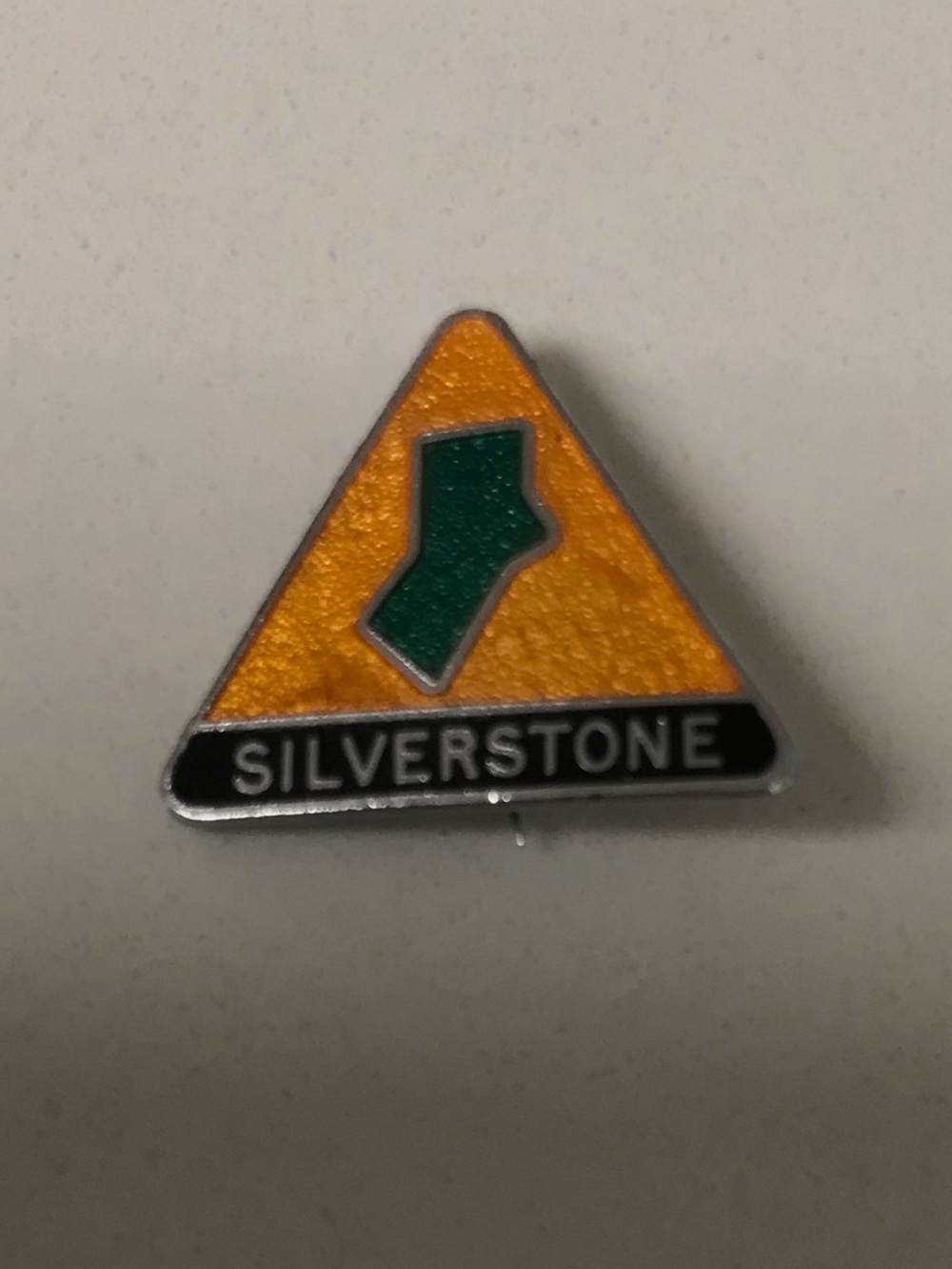 Silverstone F1 Track Triangle Logo Pin in Orange and Green enamel